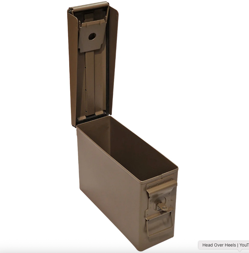 Brown metal ammunition box with open lid on a white background